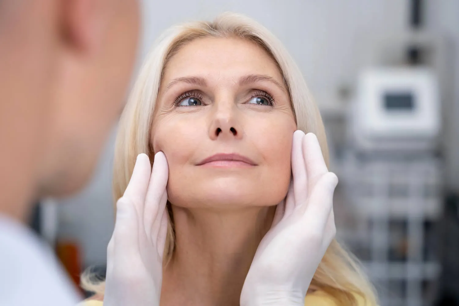 medical dermatology woman close-up-doctor-checking-smiley-woman